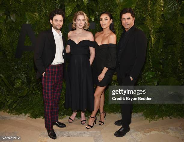 Penn Badgley, Elizabeth Lail, Shay Mitchell, and John Stamos attend the 2018 A+E Upfront on March 15, 2018 in New York City.