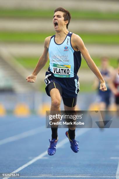 Anthony Vlatko of NSW celebrates winning the Men Under 18 800 Metre final during day three of the Australian Junior Athletics Championships at Sydney...