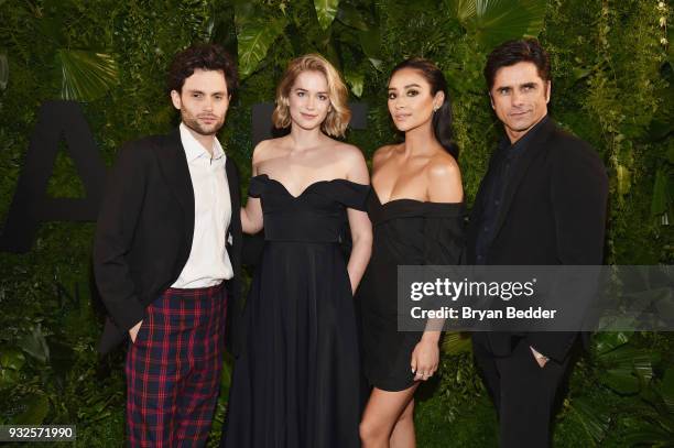 Penn Badgley, Elizabeth Lail, Shay Mitchell, and John Stamos attend the 2018 A+E Upfront on March 15, 2018 in New York City.