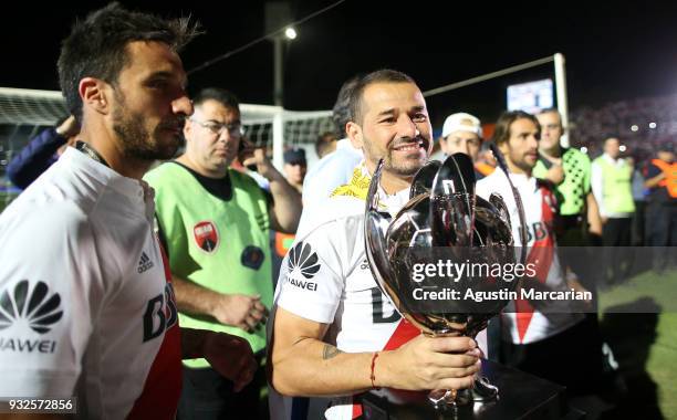 Rodrigo Mora of River Plate celebrate with the trophy after the Supercopa Argentina 2018 match against Boca Juniors at Malvinas Argentinas Stadium on...