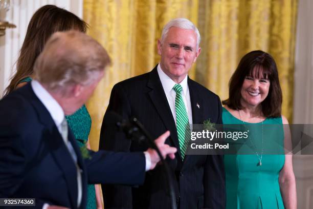 United States Vice President Mike Pence and second lady Karen Pence look on as United States President Donald J. Trump speaks during the Shamrock...