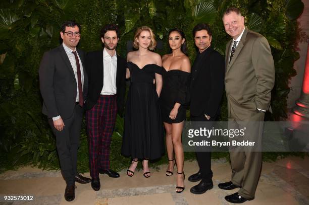 Robert Sharenow, Penn Badgley, Elizabeth Lail, Shay Mitchell, John Stamos, and Peter Olsen attend the 2018 A+E Upfront on March 15, 2018 in New York...