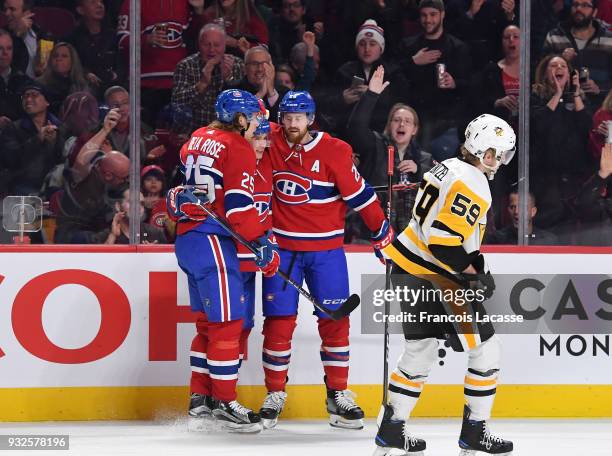 Artturi Lehkonen of the Montreal Canadiens celebrates with teammates after scoring a goal against the Pittsburgh Penguins in the NHL game at the Bell...