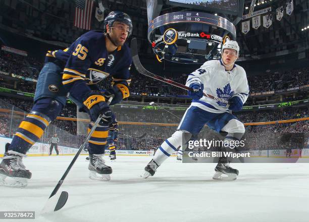 Justin Bailey of the Buffalo Sabres and Kasperi Kapanen of the Toronto Maple Leafs of the Toronto Maple Leafs follow the play during an NHL game on...