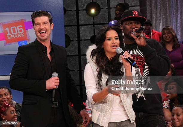 Robin Thicke, "106 & Park" host Rocsi, and 50 Cent visit BET's "106 & Park" at BET Studios on November 19, 2009 in New York City.