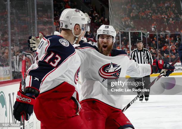 Cam Atkinson of the Columbus Blue Jackets celebrates his second period goal against the Philadelphia Flyers, his second of the game, with David...