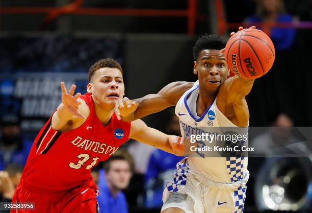 Shai Gilgeous-Alexander of the Kentucky Wildcats steals the ball from Kellan Grady of the Davidson Wildcats in the first half during the first round...