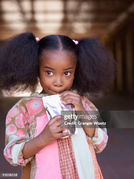 african girl drinking juice - juice box stock pictures, royalty-free photos & images