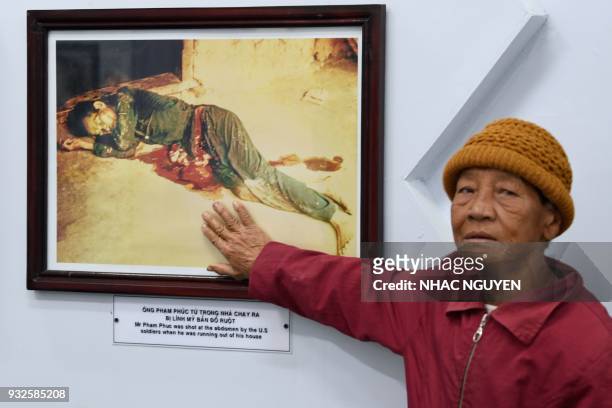 Truong Thi Tri visits the memorial museum for victims of the My Lai massacre in Son My village in Quang Ngai province on March 15, 2018. The...