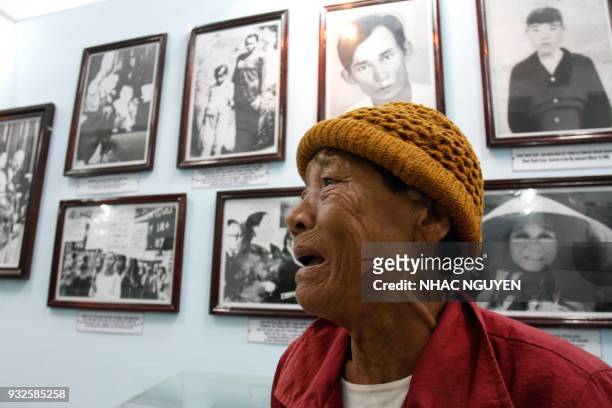 Truong Thi Tri visits the memorial museum for victims of the My Lai massacre in Son My village in Quang Ngai province on March 15, 2018. The...