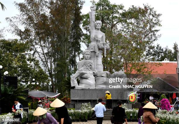 In this picture taken on March 15 workers prepare the grounds of the war memorial for victims of the My Lai massacre in Son My village, Quang Ngai...