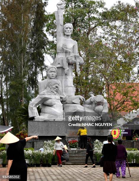 In this picture taken on March 15 workers prepare the grounds of the war memorial for victims of the My Lai massacre in Son My village, Quang Ngai...