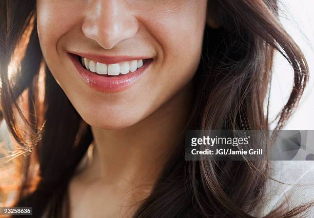 close up of hispanic woman's smile - smile close up stock-fotos und bilder
