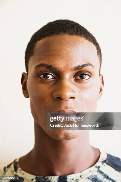 close up of serious african man - androgynous stock pictures, royalty-free photos & images