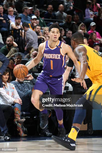 Devin Booker of the Phoenix Suns handles the ball against the Utah Jazz on March 15, 2018 at vivint.SmartHome Arena in Salt Lake City, Utah. NOTE TO...