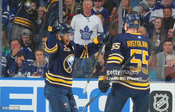 Jason Pominville celebrates his goal with Rasmus Ristolainen of the Buffalo Sabres during an NHL game against the Toronto Maple Leafs on March 15,...