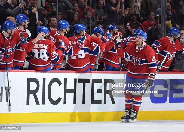 Nicolas Deslauriers of the Montreal Canadiens celebrates with the bench after scoring a goal against the Pittsburgh Penguins in the NHL game at the...