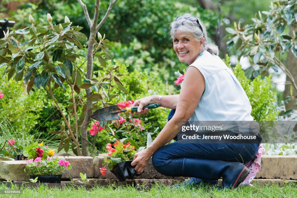 Hispanic woman gardening