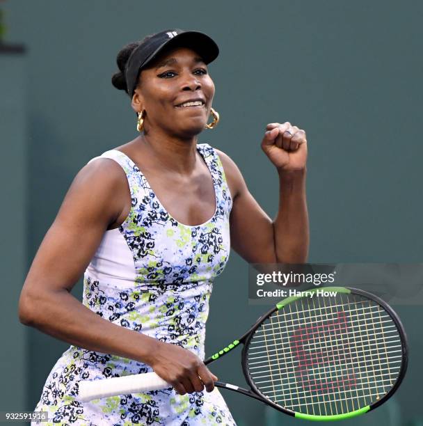 Venus Williams of the United States celebrates a straight set quarterfinal win over Carla Suarez Navarro of Spain during the BNP Paribas Open at the...