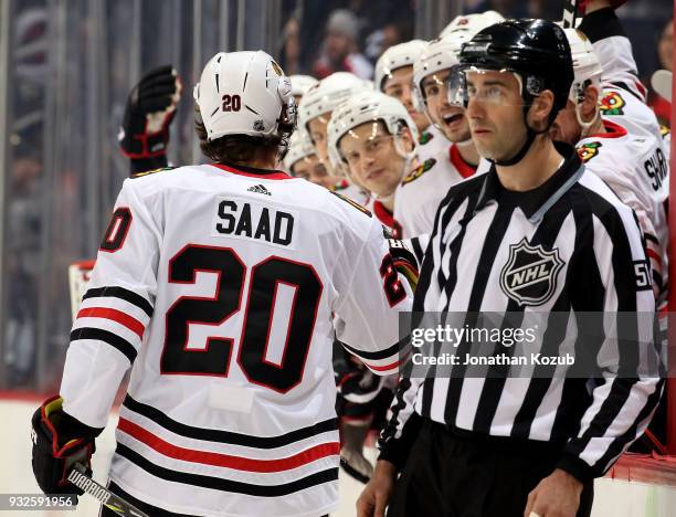 Brandon Saad of the Chicago Blackhawks celebrates his first period goal against the Winnipeg Jets with teammates at the bench at the Bell MTS Place...