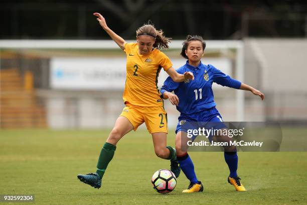 Karly Roestbakken of Australia is challenged by Anuthida Malasri of Thailand during the International match between the Young Matildas and Thailand...