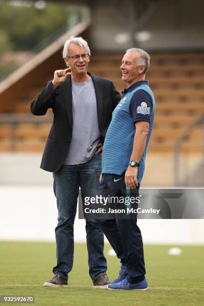 Gary van Egmond head coach of Australia talks to David Gallop chief executive of the Football Federation Australia during the International match...