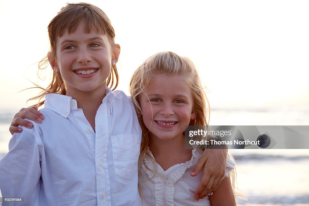 Portrait of two girls at the beach.