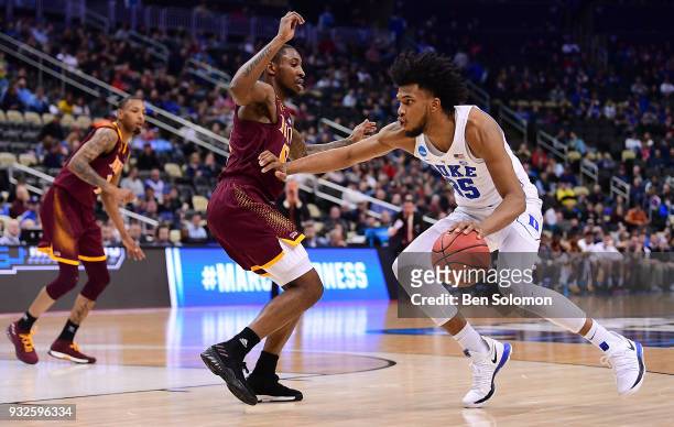 Marvin Bagley III of the Duke Blue Devils dribbles against Rickey McGill of the Iona Gaels in the second half during the first round of the 2018 NCAA...