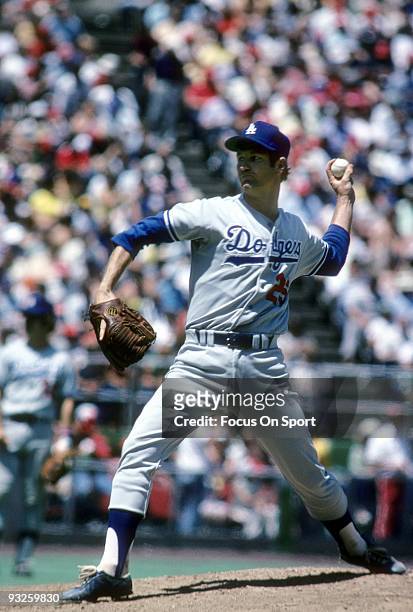 Pitcher Tommy John of the Los Angeles Dodgers pitches during a circa 1970's Major League Baseball game. John played for the Dodgers from 1972-74 and...