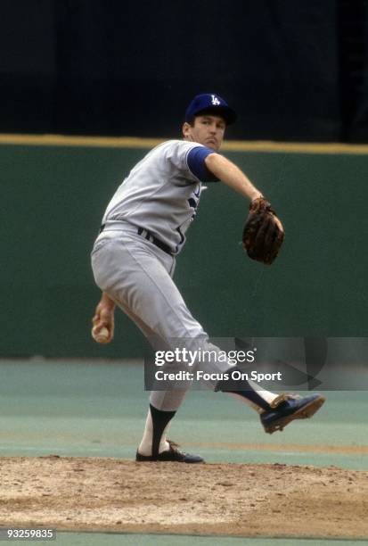 Pitcher Tommy John of the Los Angeles Dodgers pitches during a circa 1970's Major League Baseball game. John played for the Dodgers from 1972-74 and...