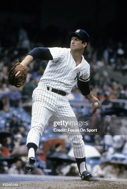 S: Pitcher Tommy John of the New York Yankees winds up to pitch during a circa 1980's Major League Baseball game at Yankee Stadium in Bronx, New...