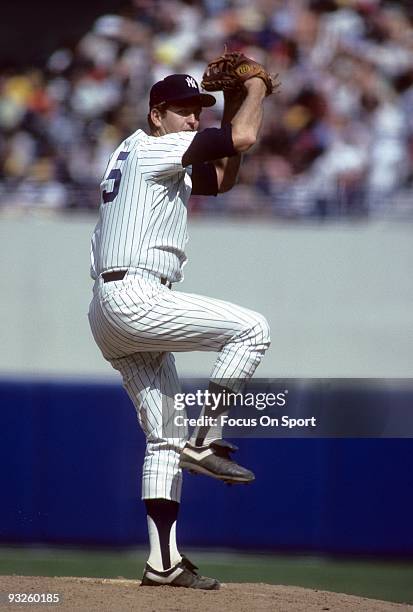 S: Pitcher Tommy John of the New York Yankees winds up to pitch during a circa 1980's Major League Baseball game at Yankee Stadium in Bronx, New...