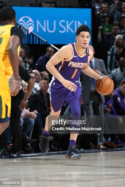 Devin Booker of the Phoenix Suns handles the ball against the Utah Jazz on March 15, 2018 at vivint.SmartHome Arena in Salt Lake City, Utah. NOTE TO...