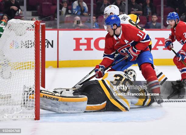 Tristan Jarry of the Pittsburgh Penguins defends the goal against Brendan Gallagher of the Montreal Canadiens in the NHL game at the Bell Centre on...