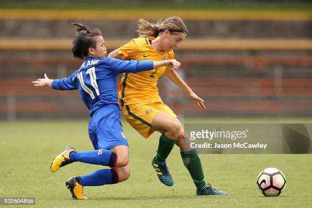 Karly Roestbakken of Australia is challenged by Anuthida Malasri of Thailand during the International match between the Young Matildas and Thailand...