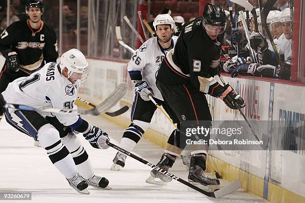 Steven Stamkos of the Tampa Bay Lighting reaches in for the puck against Bobby Ryan of the Anaheim Ducks during the game on November 19, 2009 at...