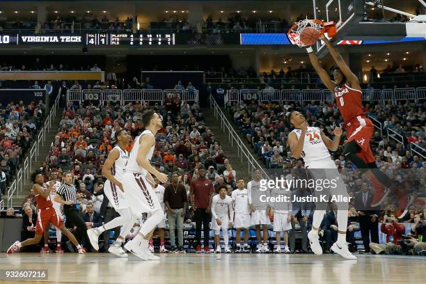 Donta Hall of the Alabama Crimson Tide dunks the ball against the Virginia Tech Hokies during the first half of the game in the first round of the...
