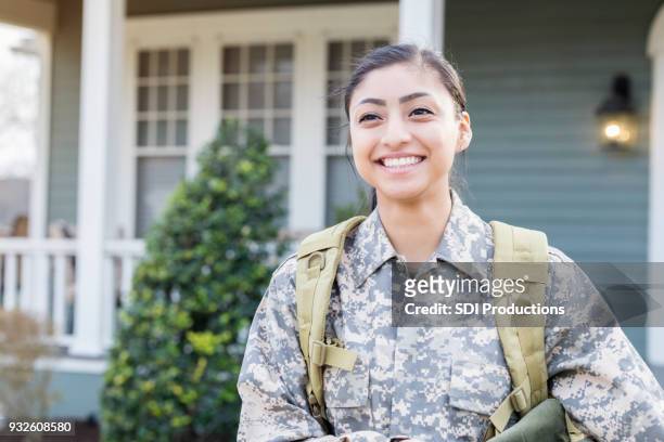 excited female soldier leaving for deployment - armed forces stock pictures, royalty-free photos & images