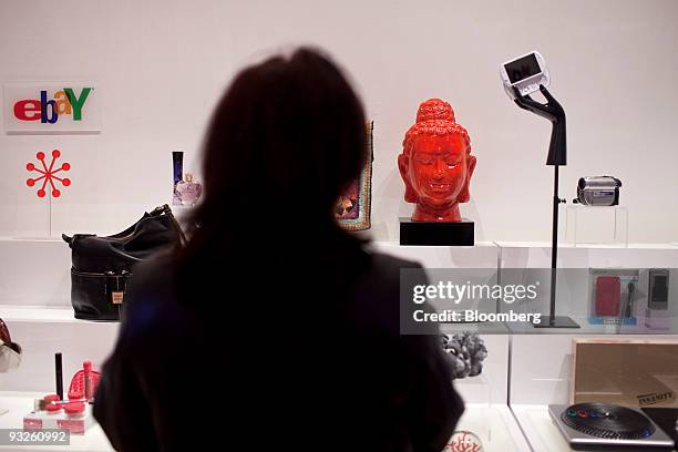 Zeny Gopez, who has never purchased an item off of eBay before, looks at a sculpture on display at the eBay @ 57th Pop-up Marketplace store in New...