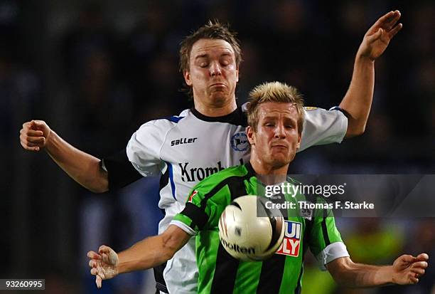 Arne Feick of Bielefeld and Stefan Aigner of Muenchen challenge for the ball during the second Bundesliga match between Arminia Bielefeld and 1860...