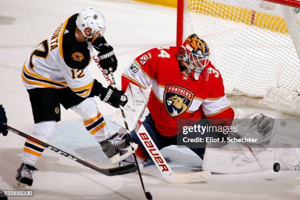 Goaltender James Reimer of the Florida Panthers defends the net against Brian Gionta of the Boston Bruins at the BB&T Center on March 15, 2018 in...