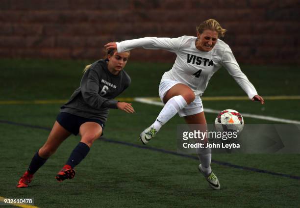 Mountain Vista Savannah Mills kicks the ball away form Columbine Chloe Cook during their soccer game on March 15, 2018 at Shea Stadium in Highlands...
