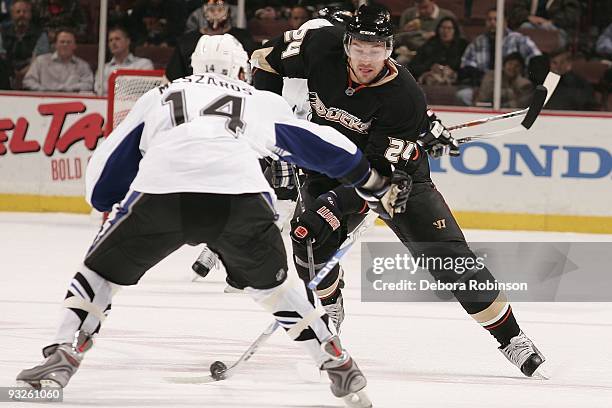 Andrej Meszaros of the Tampa Bay Lighting defends against Evgeny Artyukhin of the Anaheim Ducks during the game on November 19, 2009 at Honda Center...