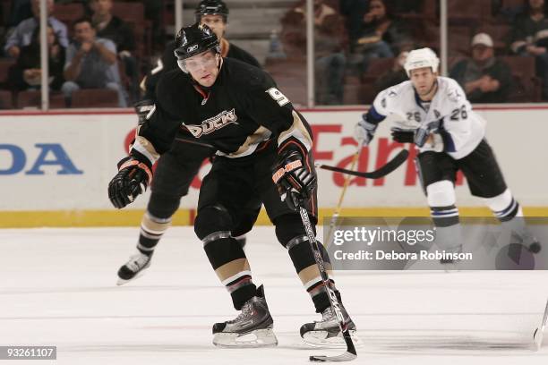 Bobby Ryan of the Anaheim Ducks handles the puck center ice against Alex Tanguay of the Tampa Bay Lighting during the game on November 19, 2009 at...