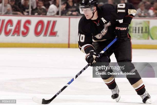 Corey Perry of the Anaheim Ducks moves the puck against the Tampa Bay Lighting during the game on November 19, 2009 at Honda Center in Anaheim,...