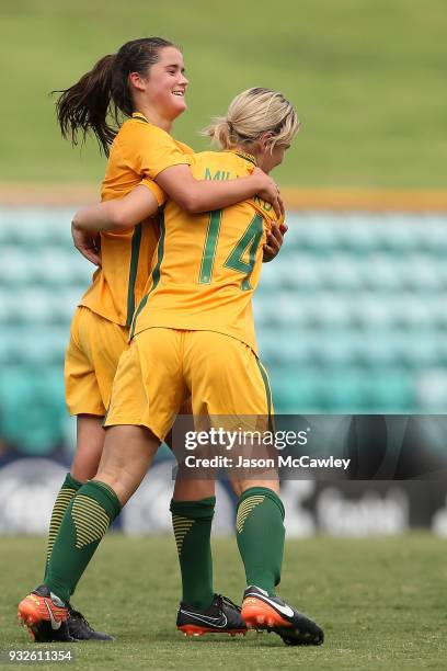 Rachel Lowe of Australia celebrates with Jayme Millard of Australia after scoring a goal during the International match between the Young Matildas...