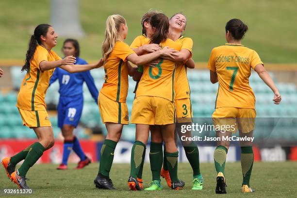 Rachel Lowe of Australia celebrates with team mates after scoring a goal during the International match between the Young Matildas and Thailand at...