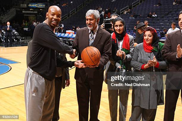 Assistant coach Sam Cassell of the Washington Wizards shakes hands with members of the Afghanistan National Basketball Federation in association with...