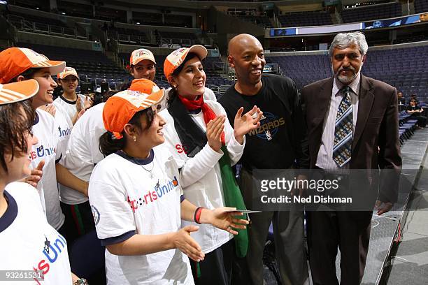 Assistant coach Sam Cassell of the Washington Wizards poses for a portrait with girls chosen by the Afghanistan National Basketball Federation in...