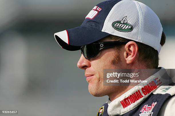 Dale Earnhardt Jr., driver of the National Guard/AMP Energy Chevrolet, stands on the grid during qualifying for the NASCAR Sprint Cup Series Ford 400...